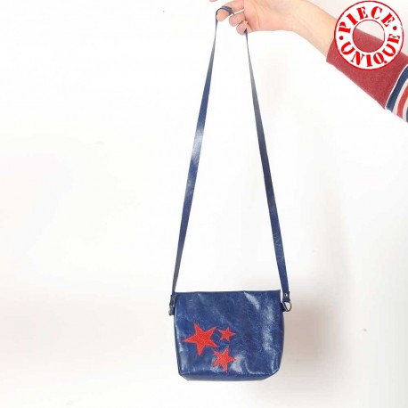 Small crossbody purse in blue varnished leather, red stars